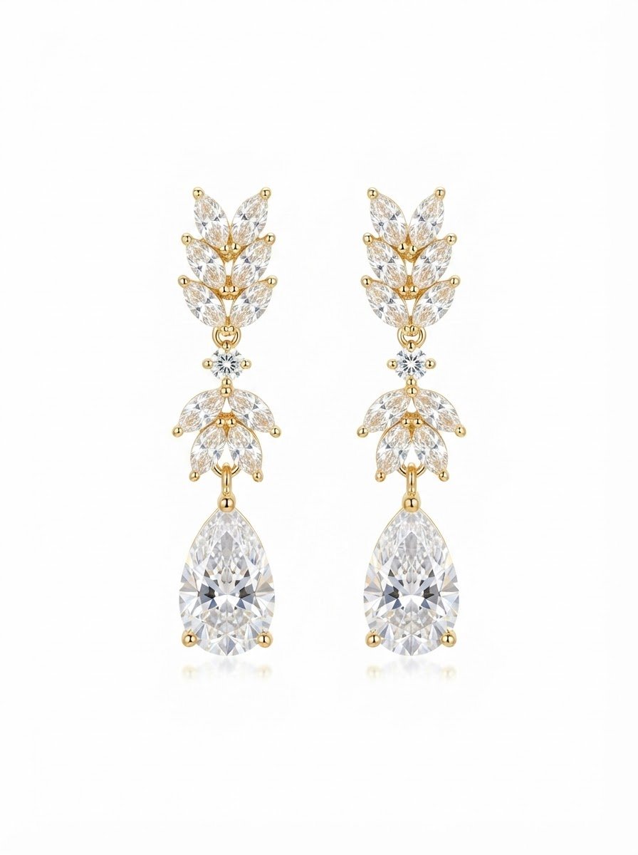 Gold diamond drop earrings with pear-shaped gemstones and floral design