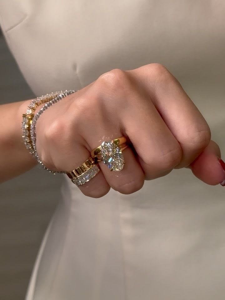 Elegant gemstone ring and bracelet worn on a woman’s hand